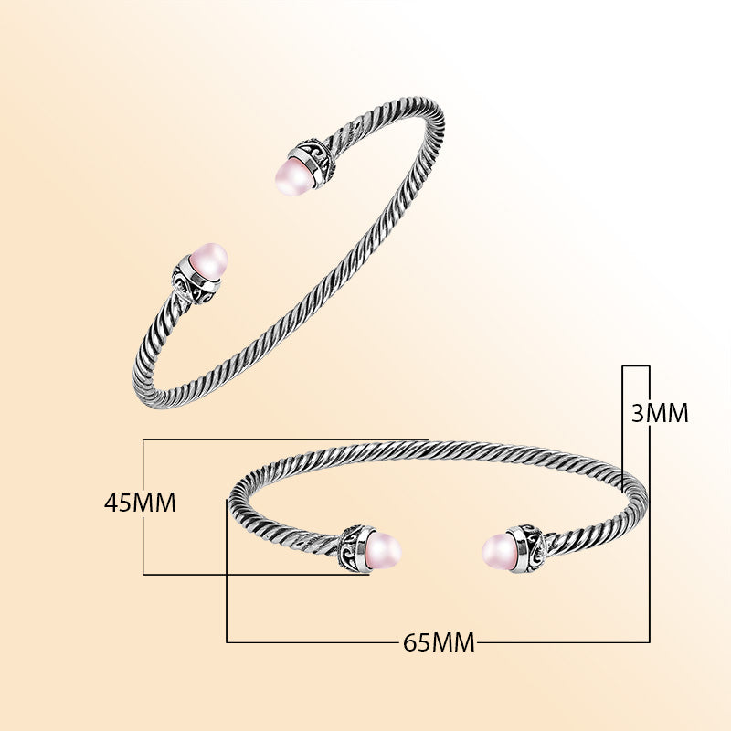 Handcrafted Sterling Silver Twisted Cable Bangle With Pink Freshwater Pearls and Oxidized Balinese Carvings.