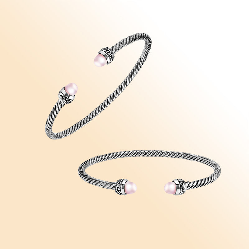 Handcrafted Sterling Silver Twisted Cable Bangle With Pink Freshwater Pearls and Oxidized Balinese Carvings.