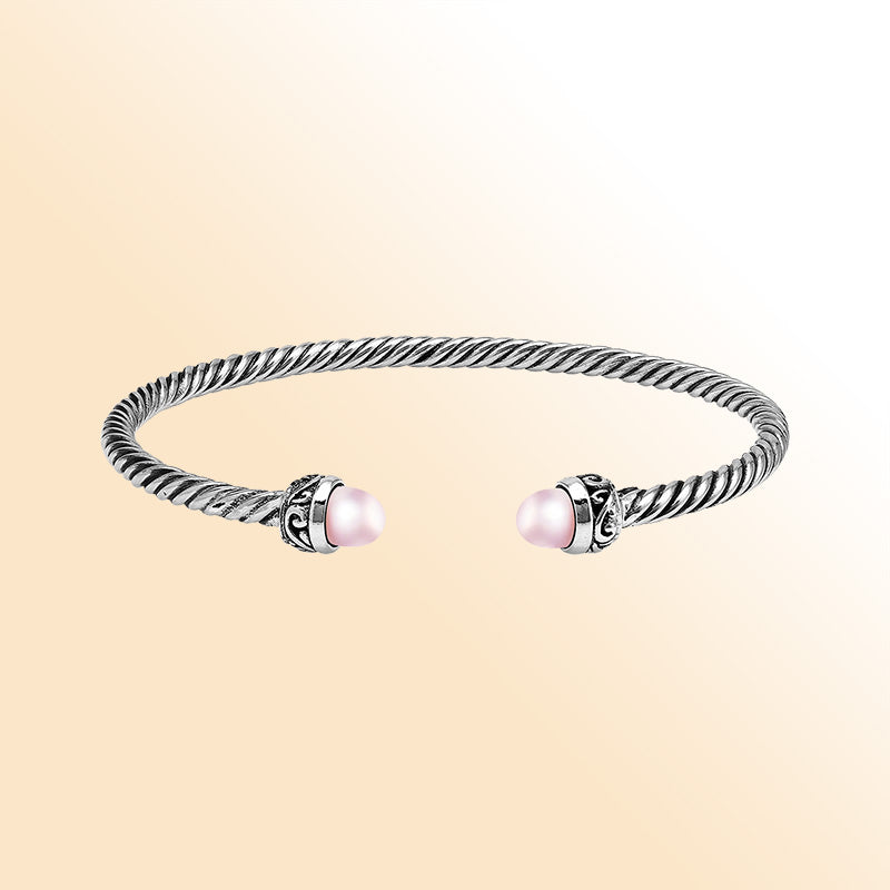 Handcrafted Sterling Silver Twisted Cable Bangle With Pink Freshwater Pearls and Oxidized Balinese Carvings.