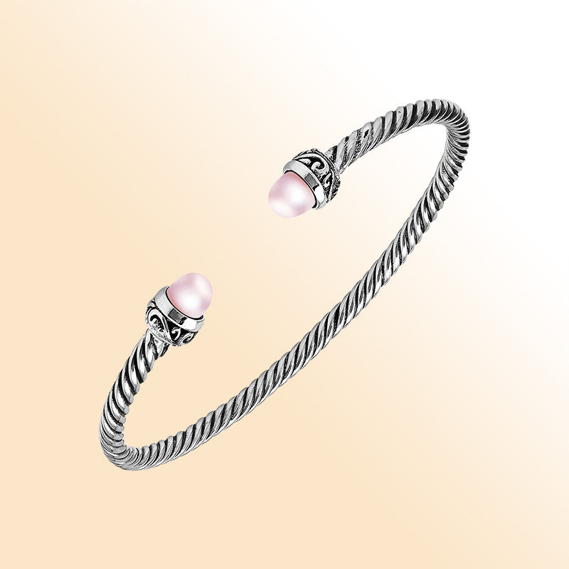 Handcrafted Sterling Silver Twisted Cable Bangle With Pink Freshwater Pearls and Oxidized Balinese Carvings.