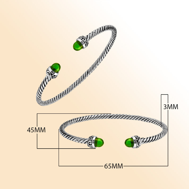 Handcrafted Sterling Silver Twisted Cable Bangle With Green Peridot Quartz and Oxidized Balinese Carvings.