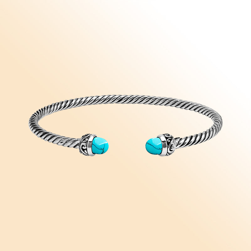 Handcrafted Sterling Silver Twisted Cable Bangle With Turquoise Shell and Oxidized Balinese Carvings.