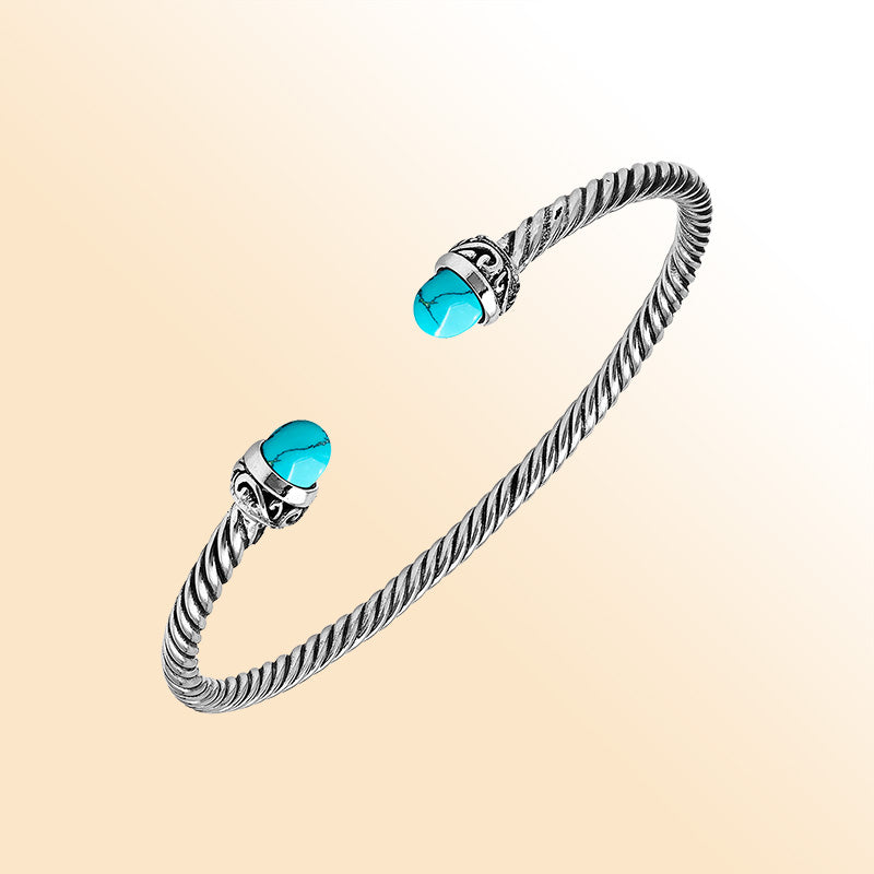 Handcrafted Sterling Silver Twisted Cable Bangle With Turquoise Shell and Oxidized Balinese Carvings.