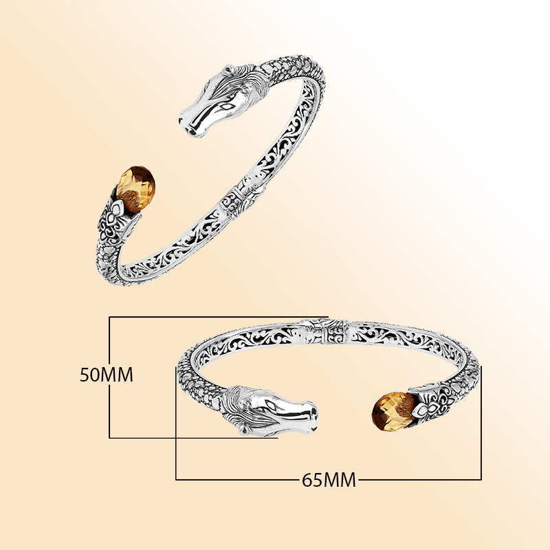 Handcrafted sterling silver dragon head bangle with Citrine Quartz from Bali featuring detailed filigree and antique silver finish.