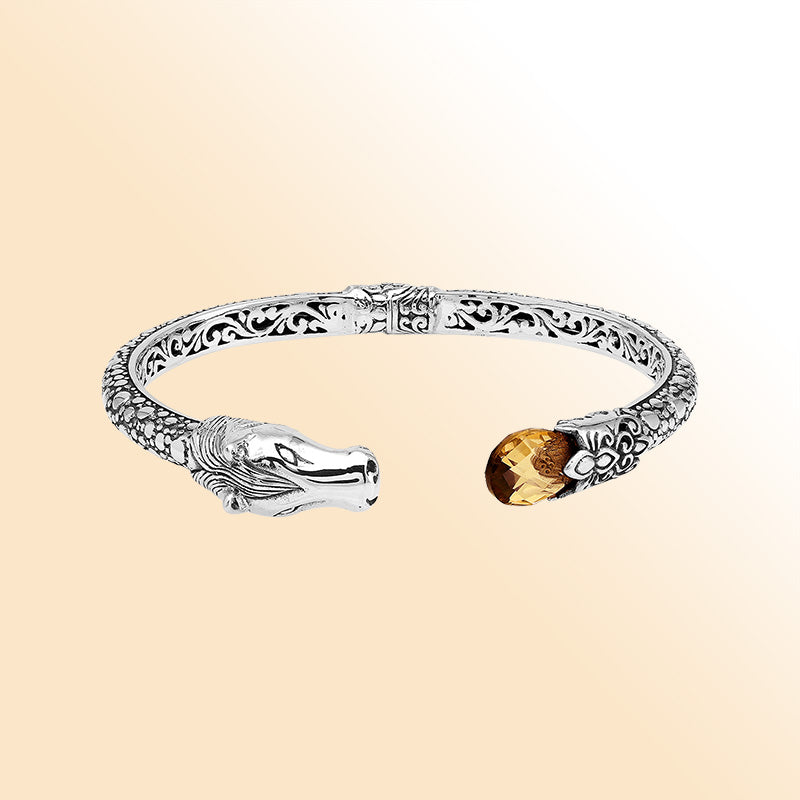 Handcrafted sterling silver dragon head bangle with Citrine Quartz from Bali featuring detailed filigree and antique silver finish.