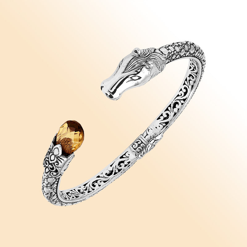 Handcrafted sterling silver dragon head bangle with Citrine Quartz from Bali featuring detailed filigree and antique silver finish.
