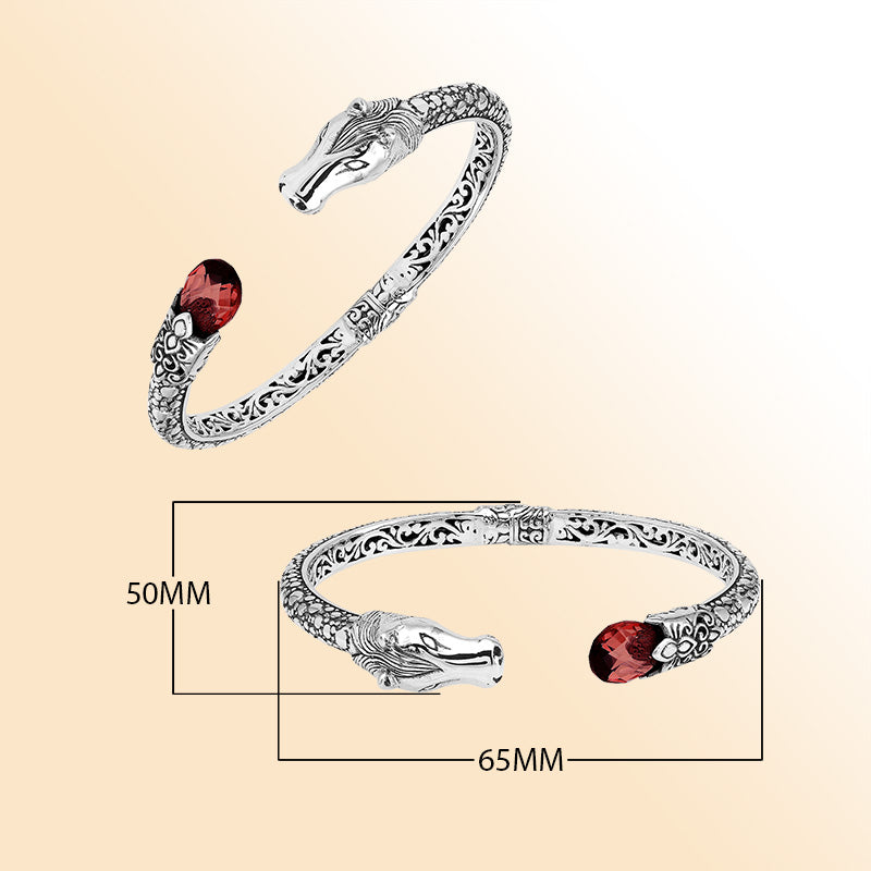 Handcrafted sterling silver dragon head bangle with Garnet Quartz from Bali featuring detailed filigree and antique finish.