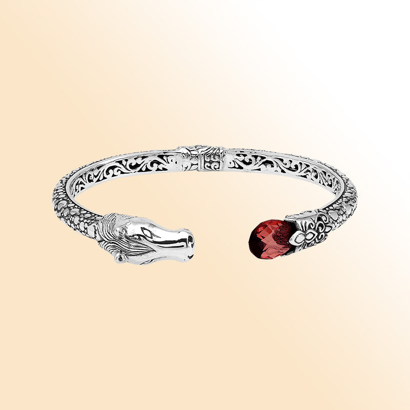 Handcrafted sterling silver dragon head bangle with Garnet Quartz from Bali featuring detailed filigree and antique finish.