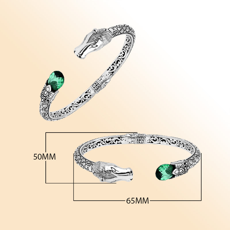 Handcrafted sterling silver dragon head bangle with Green Quartz from Bali featuring detailed filigree and antique silver finish.