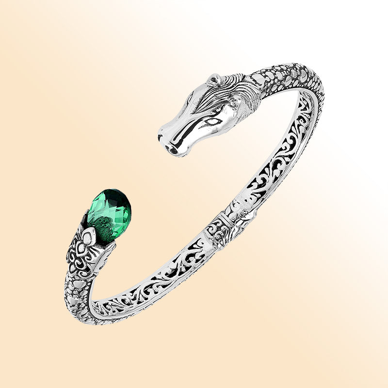 Handcrafted sterling silver dragon head bangle with Green Quartz from Bali featuring detailed filigree and antique silver finish.