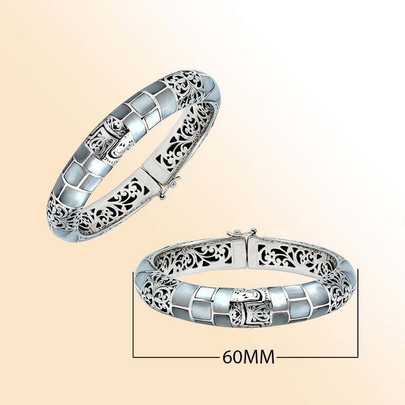 Handcrafted sterling silver mother of pearl inlay hinged bangle with filigree accents made in Bali.