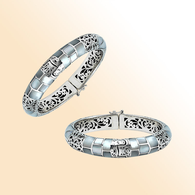Handcrafted sterling silver mother of pearl inlay hinged bangle with filigree accents made in Bali.