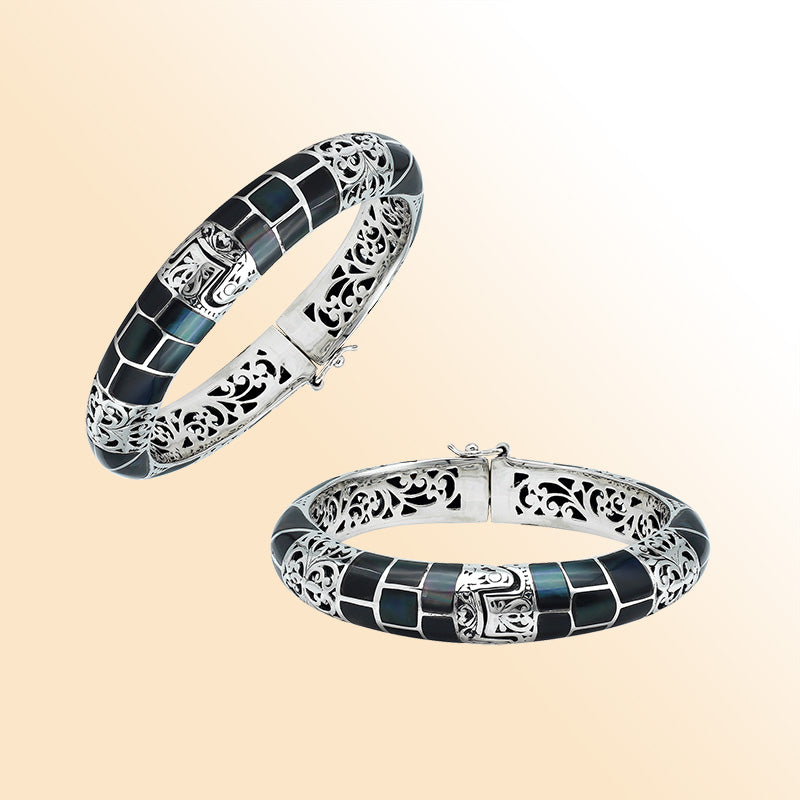 Handcrafted sterling silver bangle with black shell mosaic inlay and intricate filigree pattern from Bali.