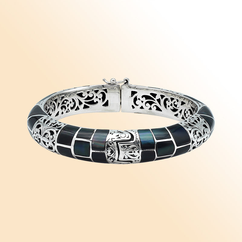 Handcrafted sterling silver bangle with black shell mosaic inlay and intricate filigree pattern from Bali.