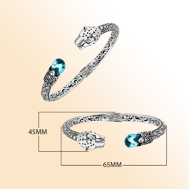 Handcrafted sterling silver cuff with blue topaz quartz and panther head design made in Bali.