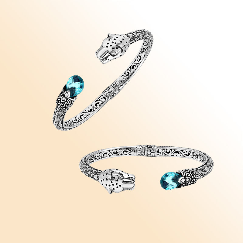 Handcrafted sterling silver cuff with blue topaz quartz and panther head design made in Bali.