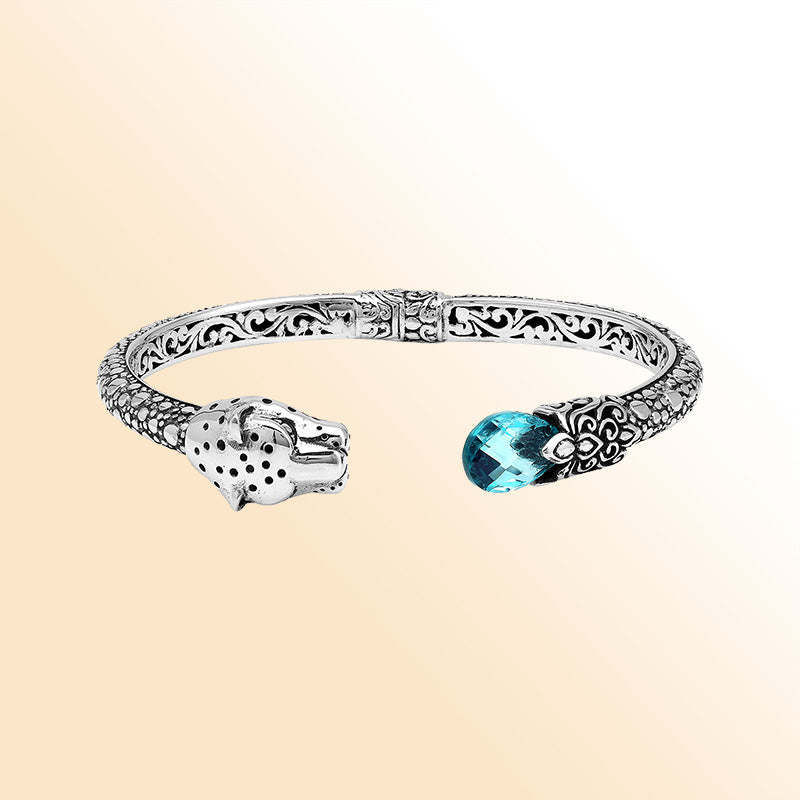 Handcrafted sterling silver cuff with blue topaz quartz and panther head design made in Bali.