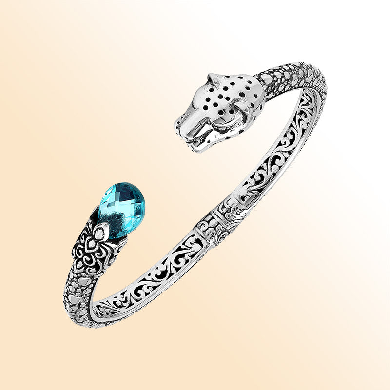 Handcrafted sterling silver cuff with blue topaz quartz and panther head design made in Bali.