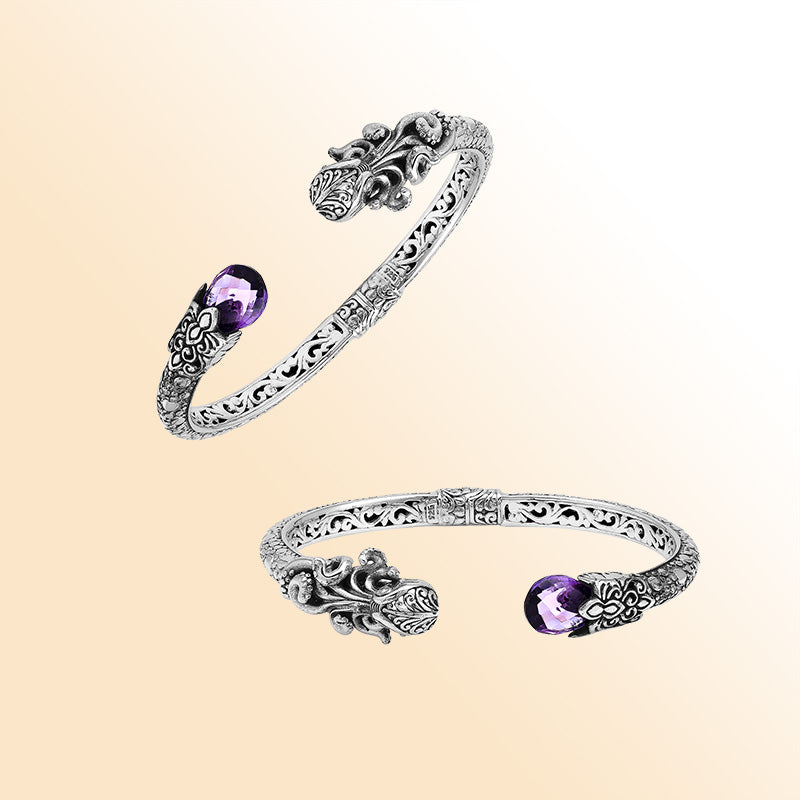 A handcrafted sterling silver octopus bangle featuring amethyst quartz, detailed tentacle carvings, oxidized Balinese textures, and a smooth hinge lock for elegant everyday or statement wear.