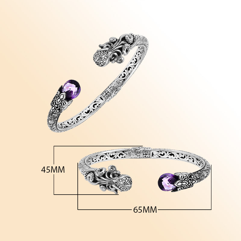 A handcrafted sterling silver octopus bangle featuring amethyst quartz, detailed tentacle carvings, oxidized Balinese textures, and a smooth hinge lock for elegant everyday or statement wear.