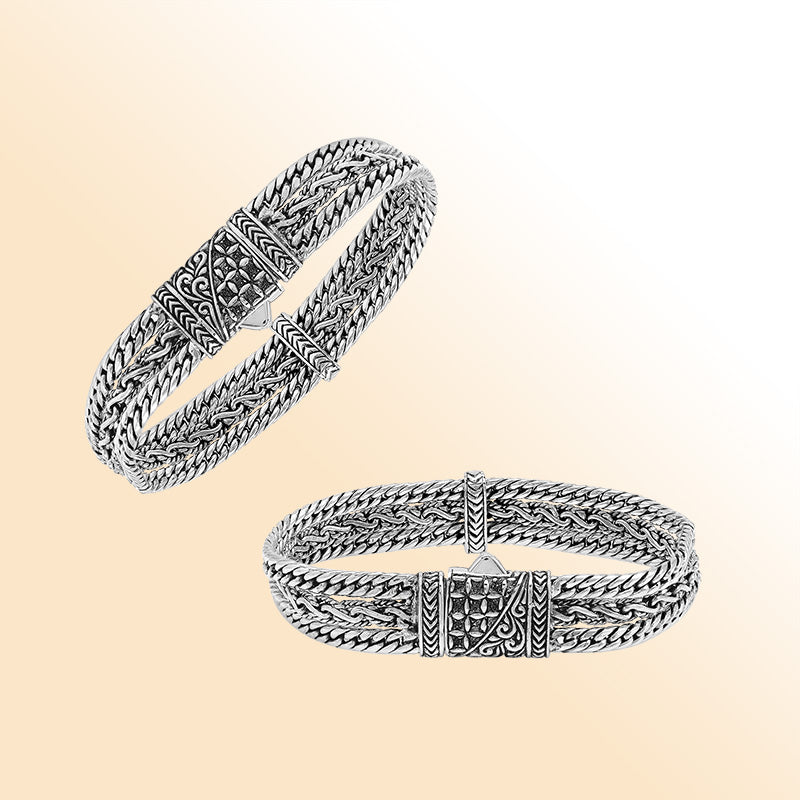 A handcrafted sterling silver woven chain bracelet featuring multi-strand Balinese detailing, oxidized textures, and a secure push clasp designed for stylish everyday wear.