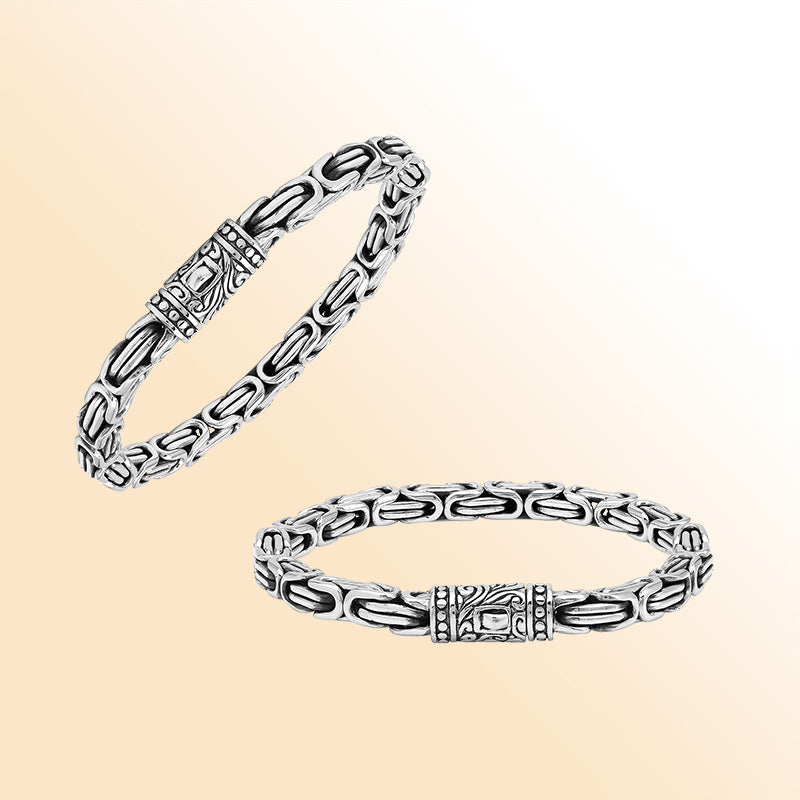 A handcrafted sterling silver bracelet featuring thick Balinese chain links, oxidized highlights, artistic metalwork, and a strong push clasp perfect for everyday luxury wear.