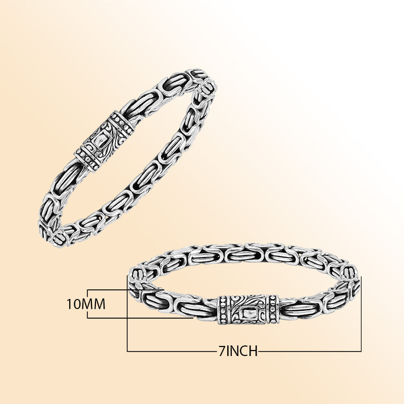 A handcrafted sterling silver bracelet featuring thick Balinese chain links, oxidized highlights, artistic metalwork, and a strong push clasp perfect for everyday luxury wear.