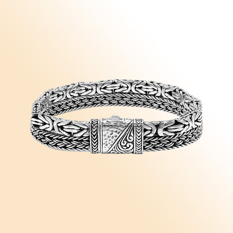 Handcrafted sterling silver woven bracelet featuring detailed Bali patterns and a secure push lock clasp, designed for stylish everyday wear and gifting.