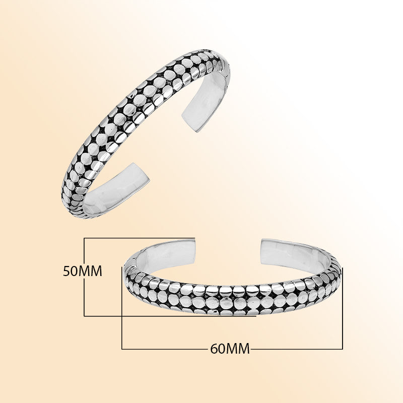 Handcrafted sterling silver medium bangle with polished dot pattern design, oxidized detailing, and a secure hinge lock for comfortable and stylish daily wear.