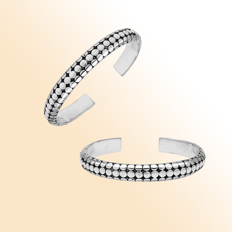 Handcrafted sterling silver medium bangle with polished dot pattern design, oxidized detailing, and a secure hinge lock for comfortable and stylish daily wear.