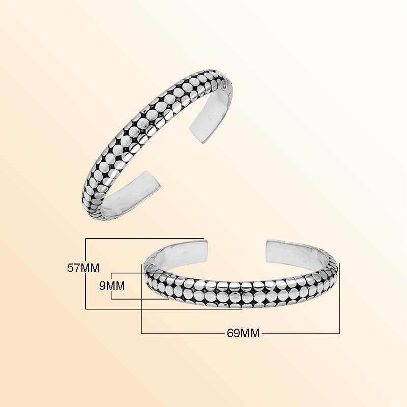 Handcrafted sterling silver medium bangle with polished dot pattern design, oxidized detailing, and a secure hinge lock for comfortable and stylish daily wear.