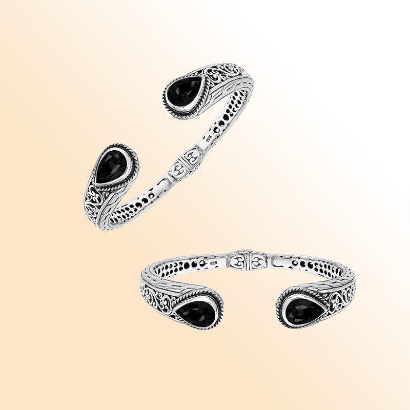 Sterling silver hinge-lock cuff bangle with Black Onyx teardrops and ornate Balinese carvings.