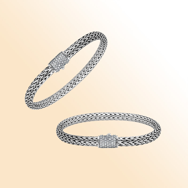 A handcrafted sterling silver elegant woven bracelet featuring a radiant CVD Diamond-studded push clasp, polished–oxidized detailing, and modern luxury styling ideal for everyday wear.