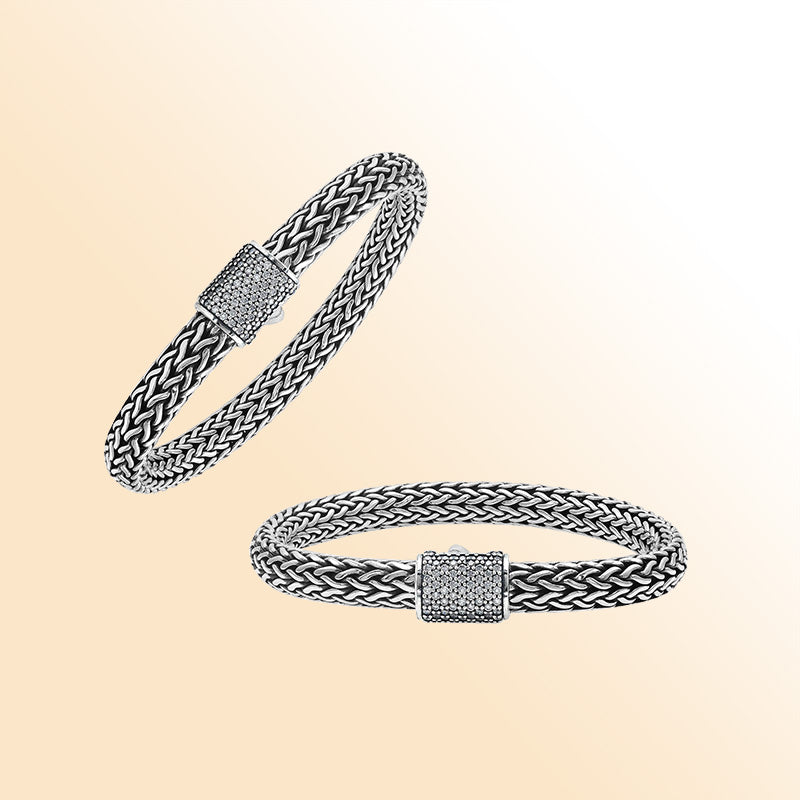A handcrafted sterling silver radiant woven bracelet featuring a sparkling CVD Diamond-studded push clasp, polished and oxidized detailing, crafted for luxurious modern everyday wear.