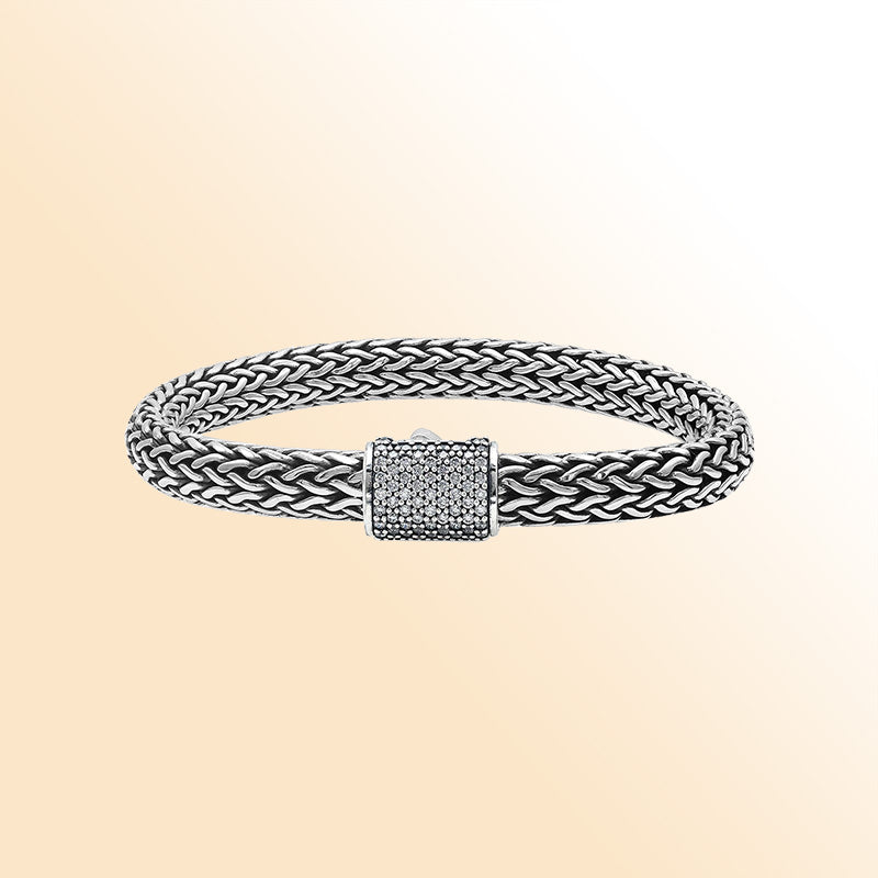 A handcrafted sterling silver radiant woven bracelet featuring a sparkling CVD Diamond-studded push clasp, polished and oxidized detailing, crafted for luxurious modern everyday wear.