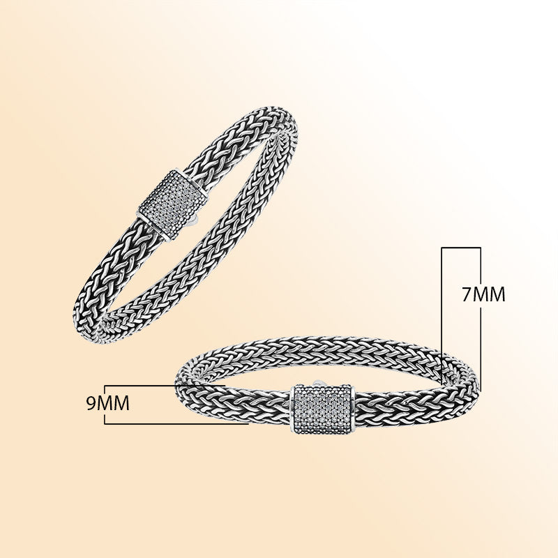 A handcrafted sterling silver radiant woven bracelet featuring a sparkling CVD Diamond-studded push clasp, polished and oxidized detailing, crafted for luxurious modern everyday wear.