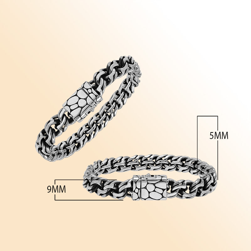 A handcrafted sterling silver rugged woven bracelet featuring a textured push clasp, polished and oxidized detailing, and bold masculine styling perfect for everyday wear.