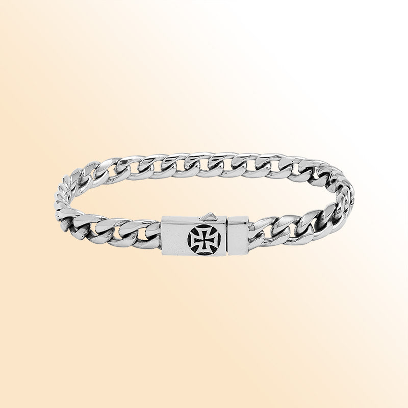 A handcrafted sterling silver polished curb bracelet featuring a detailed engraved Push Clasp, smooth reflective finishing, and contemporary styling for elegant everyday wear.