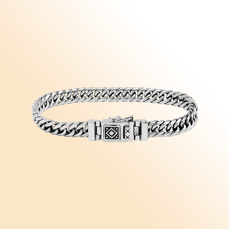 Sterling Silver chain bracelet showcasing an artistic tribal clasp motif and a high-gloss polished surface that creates an elegant, expressive, and timeless accessory suitable for any style preference.