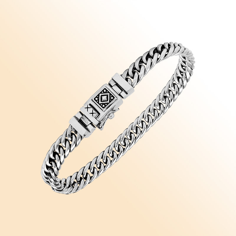Sterling Silver chain bracelet showcasing an artistic tribal clasp motif and a high-gloss polished surface that creates an elegant, expressive, and timeless accessory suitable for any style preference.