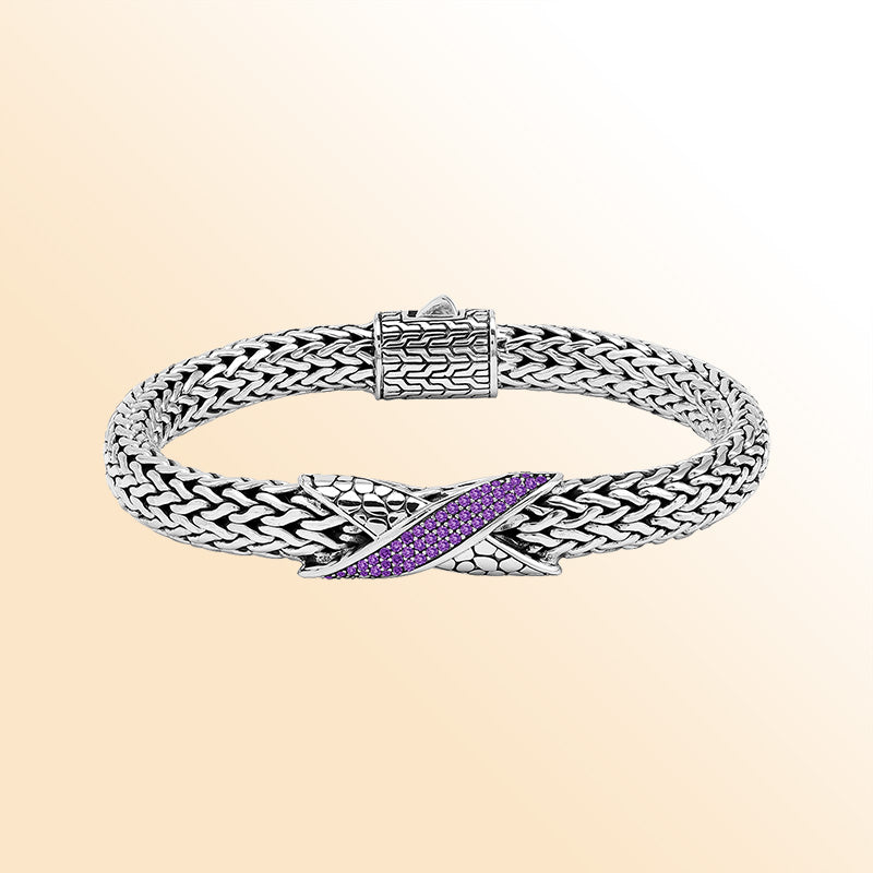 Sterling Silver woven bracelet featuring an artistic Amethyst Quartz accent and a polished push clasp, crafted with refined details and luminous high-gloss finish for a sophisticated accessory.