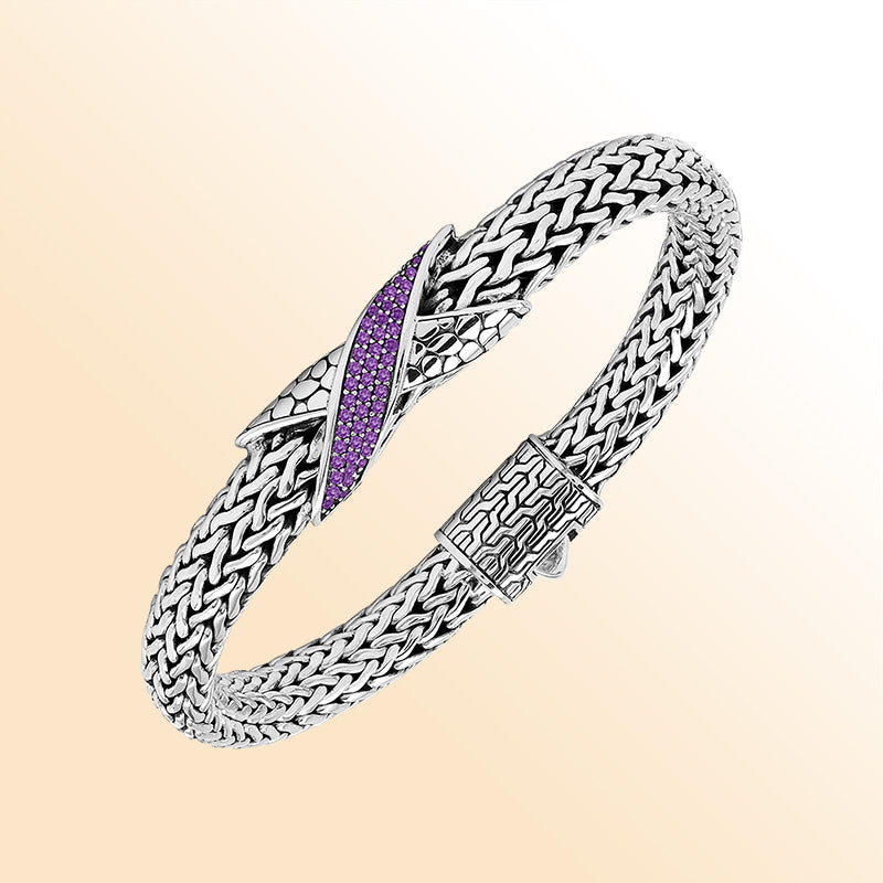 Sterling Silver woven bracelet featuring an artistic Amethyst Quartz accent and a polished push clasp, crafted with refined details and luminous high-gloss finish for a sophisticated accessory.
