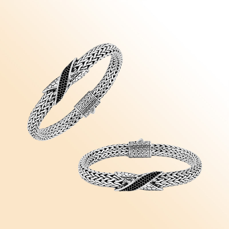 Sterling Silver woven bracelet showcasing an artistic Cubic Zirconia accent with a luminous mirror-polished finish, designed to provide an elegant and expressive accessory with detailed craftsmanship.
