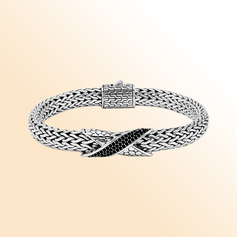 Sterling Silver woven bracelet showcasing an artistic Cubic Zirconia accent with a luminous mirror-polished finish, designed to provide an elegant and expressive accessory with detailed craftsmanship.