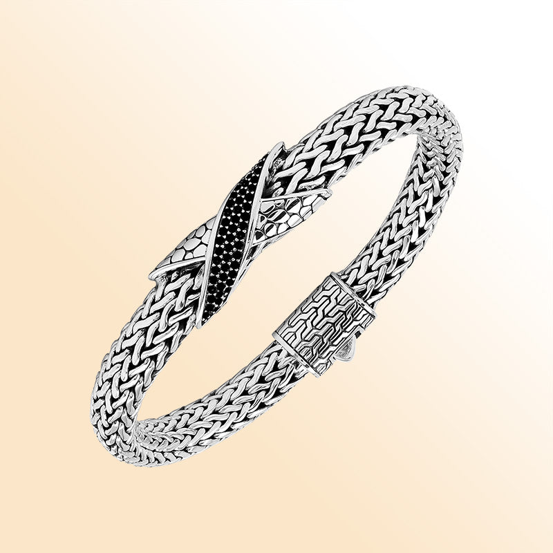 Sterling Silver woven bracelet showcasing an artistic Cubic Zirconia accent with a luminous mirror-polished finish, designed to provide an elegant and expressive accessory with detailed craftsmanship.