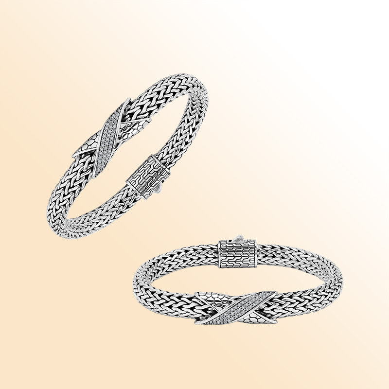 Sterling Silver woven bracelet featuring a sparkling Cubic Zirconia crisscross motif, polished to a bright mirror finish for an expressive accessory with detailed craftsmanship and refined visual appeal.