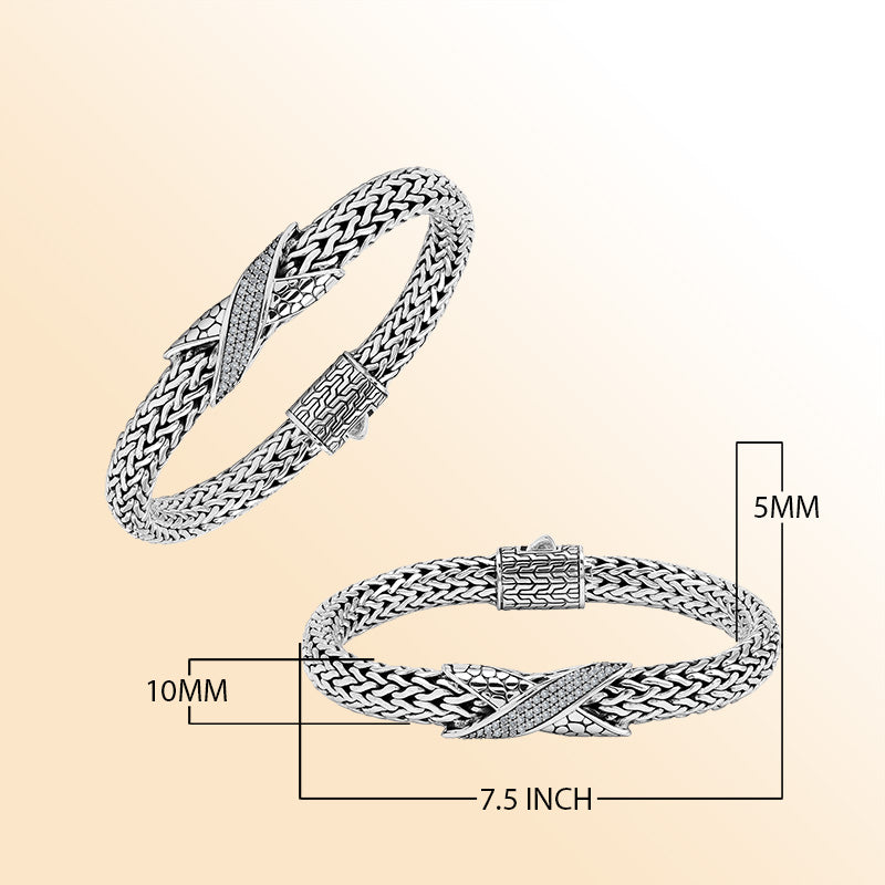Sterling Silver woven bracelet featuring a sparkling Cubic Zirconia crisscross motif, polished to a bright mirror finish for an expressive accessory with detailed craftsmanship and refined visual appeal.