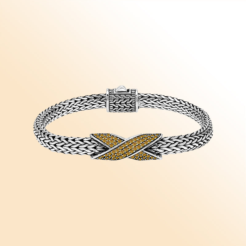  Handcrafted sterling silver woven bracelet featuring a radiant purple Citrine quartz crossover design from Bali.