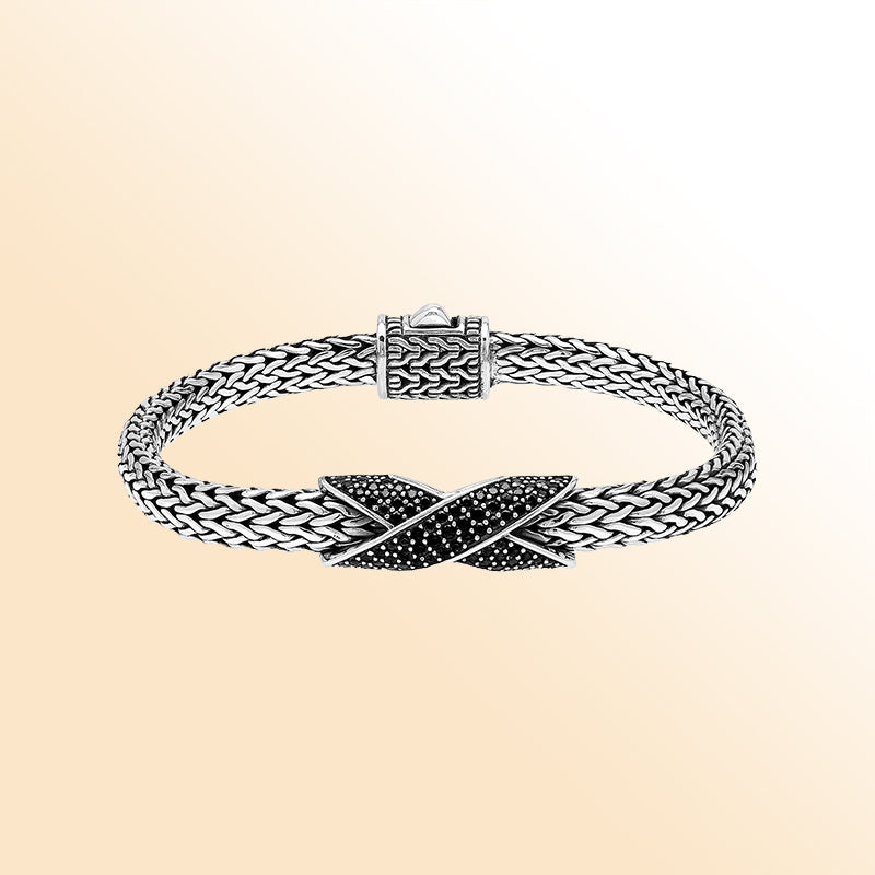 Sterling Silver woven designer bracelet with bold criss-cross centerpiece set in shimmering Black Cubic Zirconia, offering a luxurious and modern statement look for sophisticated everyday and evening style.