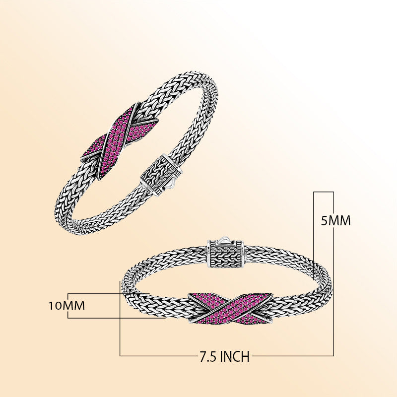 Handcrafted sterling silver woven bracelet featuring a radiant purple Ruby Quartz crossover design from Bali.